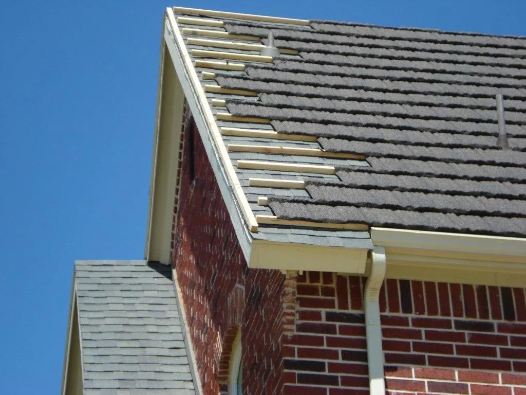 Crew installing a Gerard Canyon Shake roof over composition shingles